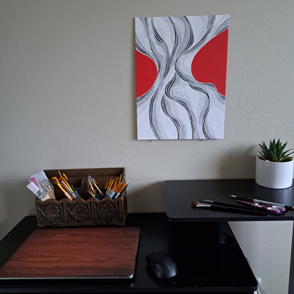 Staged photo of the "Grooves" painting hung up on a wall behind a desk